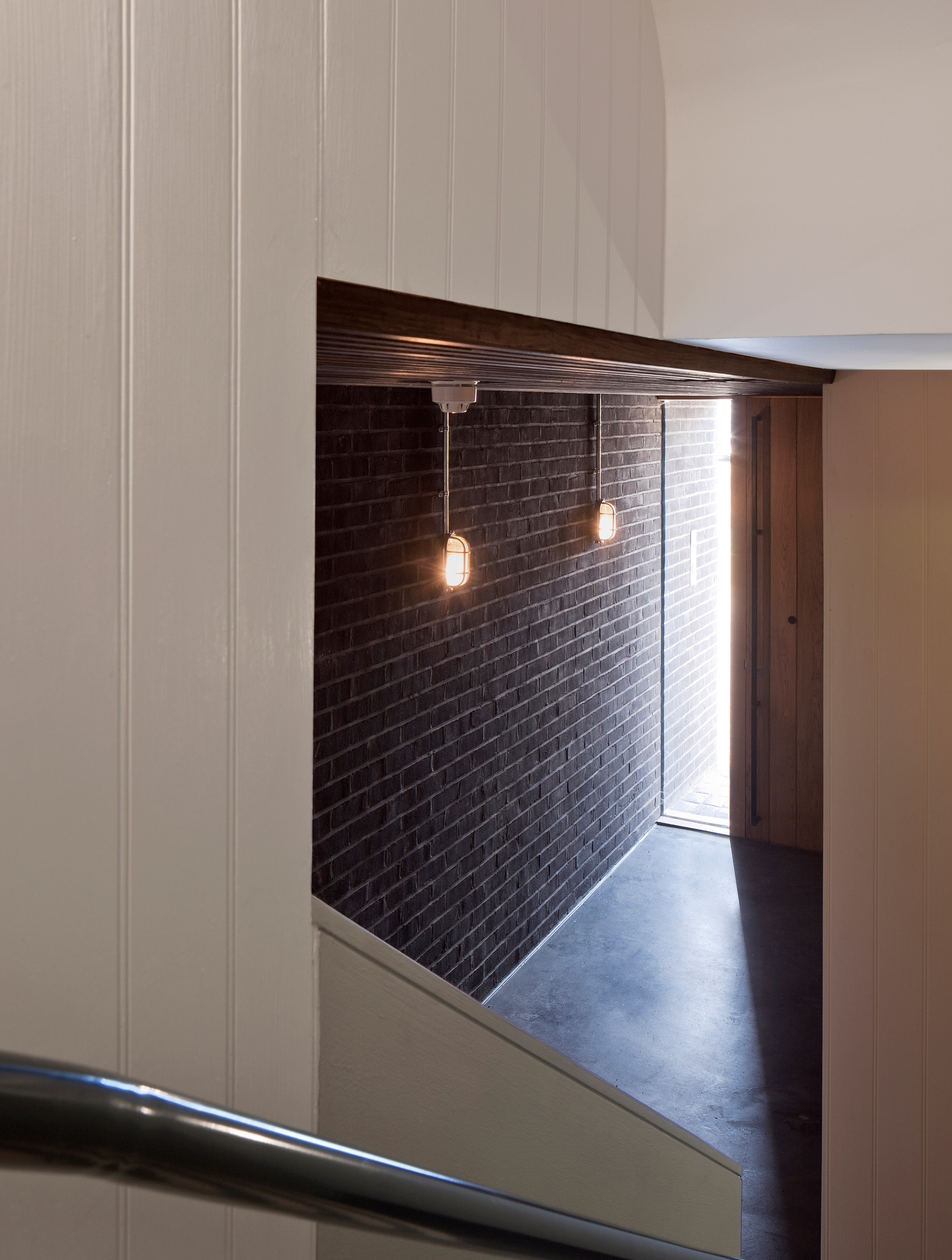 Denizen Works pairs black bricks with pointy panels for Whitstable housing-20