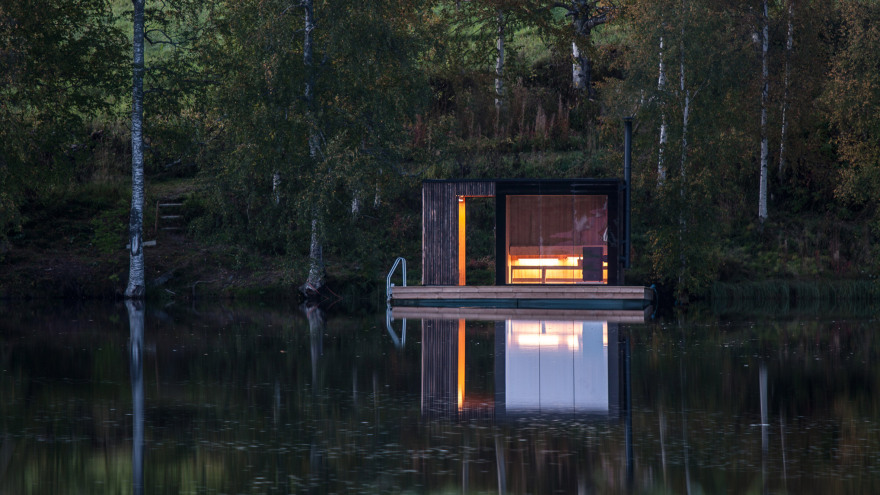 Small Architecture Workshop's charred-wood sauna floats on Swedish lake-14