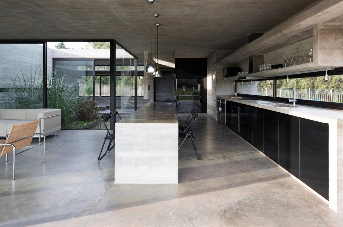 Spectacular Concrete House Surrounded by Fields and Vegetation-32