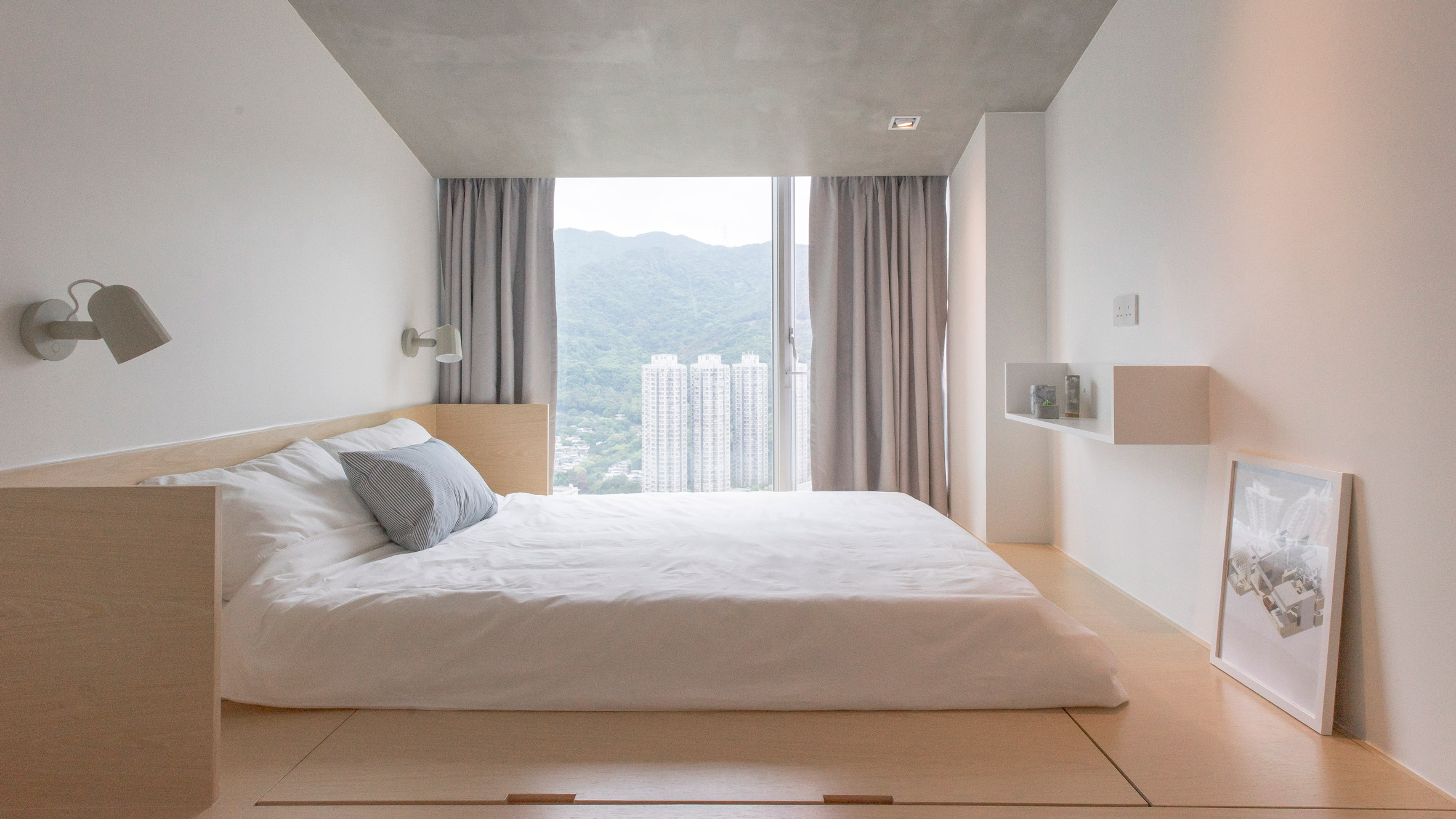 House-shaped frame encloses dining area in compact Hong Kong apartment-0