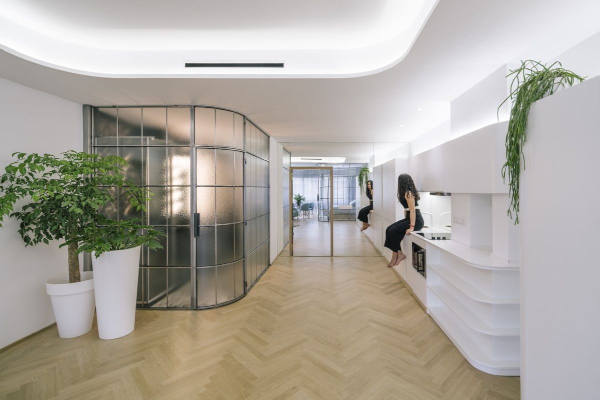 Glass Walls and Lots of Curves Distinguish Luxury Madrid Apartment Renovation-6