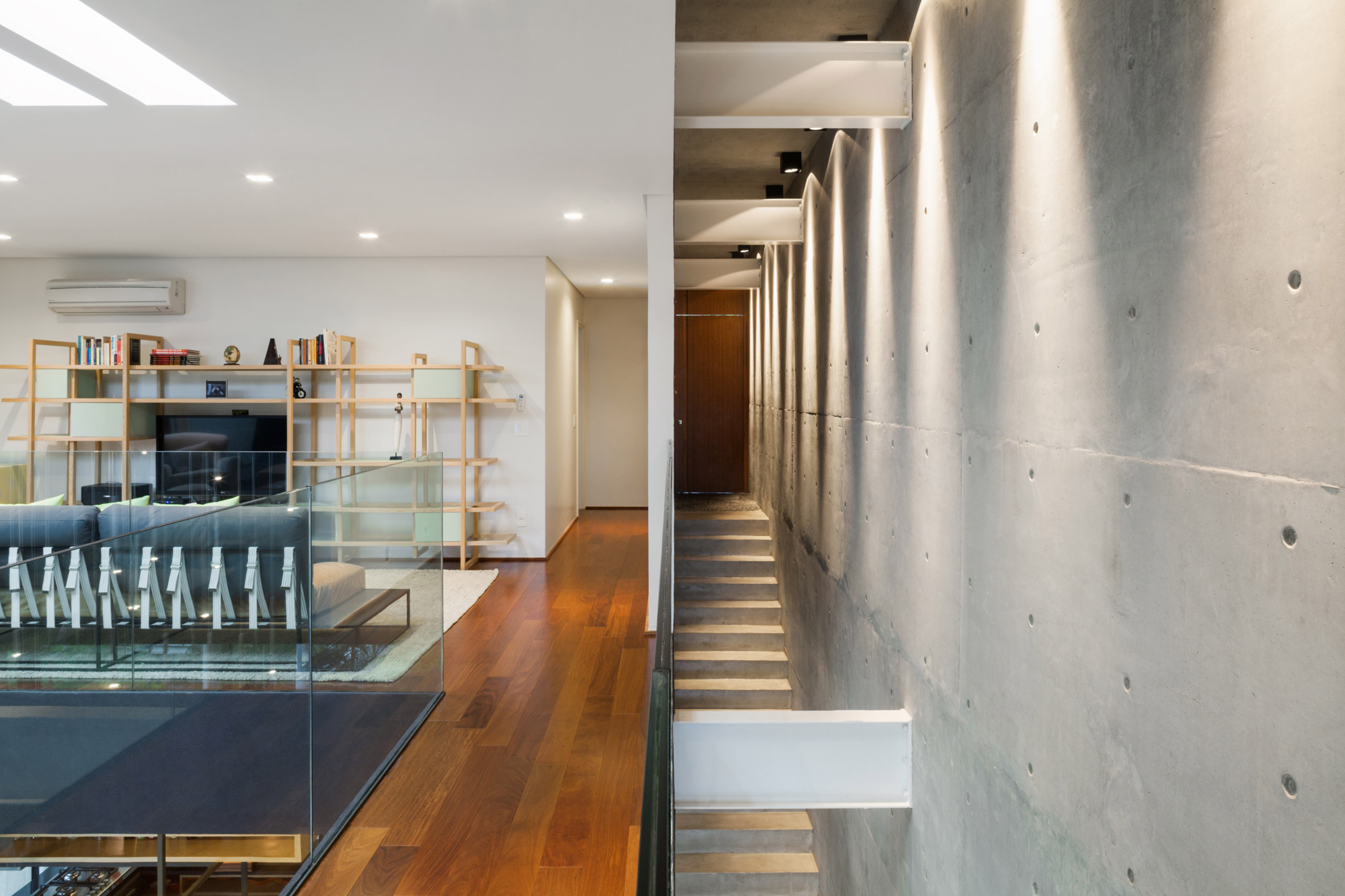 Concrete volume appears to rest on glass in Brazilian house by FGMF Arquitetos-9