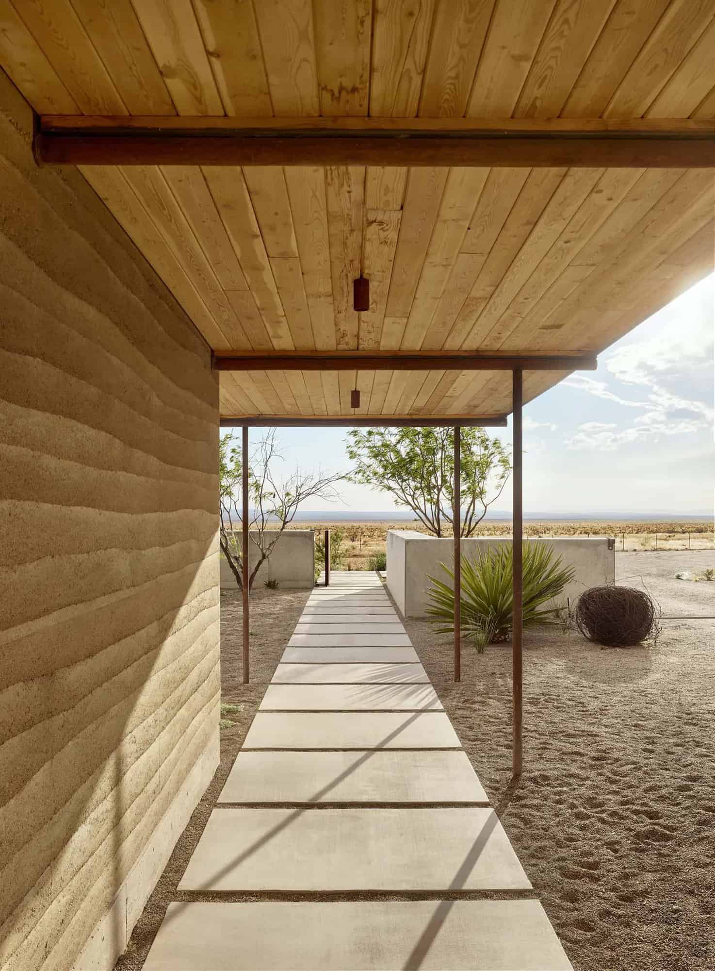 See this remarkable rammed earth house nestled on a Texas ranch-28