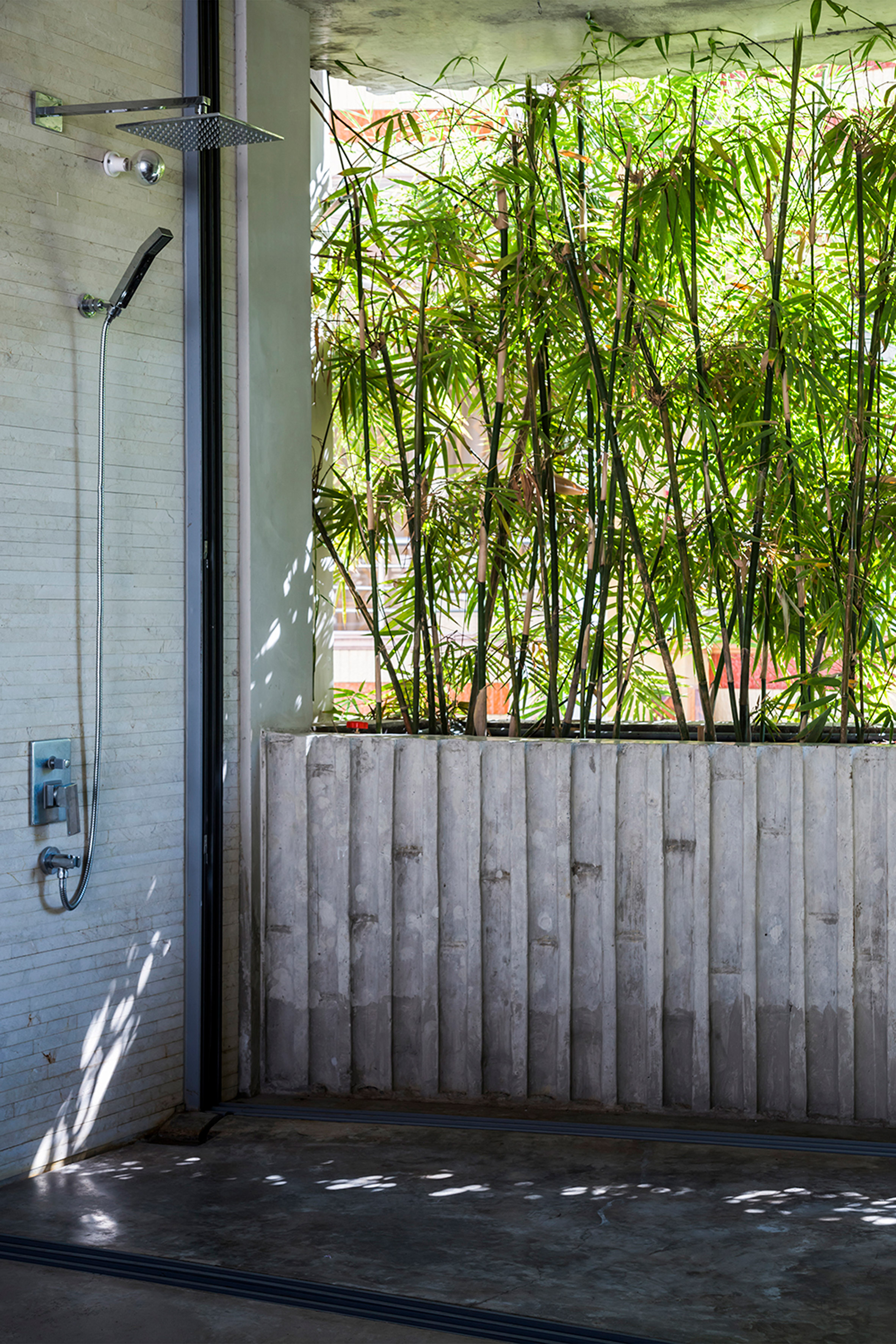 Vo Trong Nghia fronts narrow house in Vietnam with huge bamboo plant boxes-26