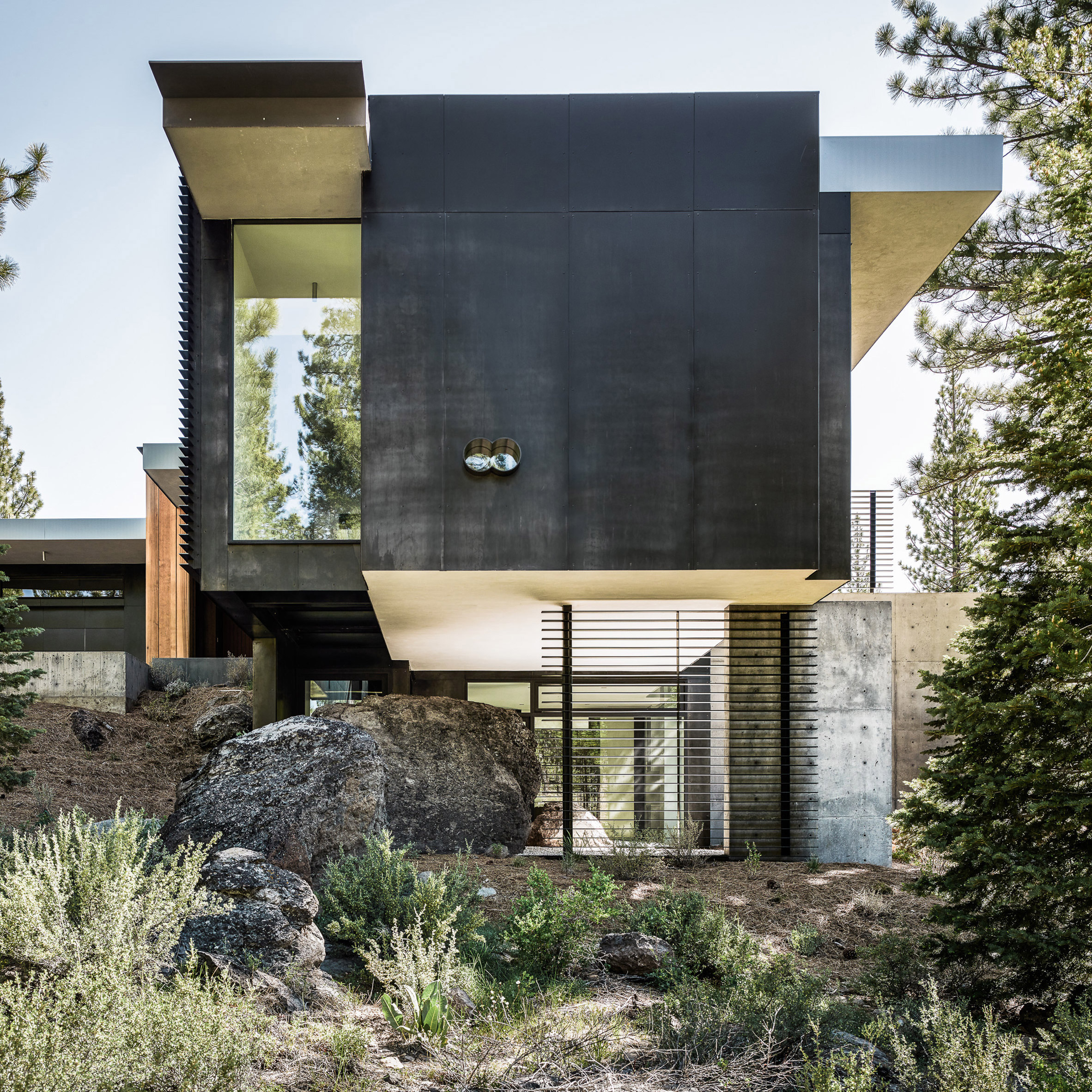 Creek House by Faulkner Architects preserves boulders on steep site-0