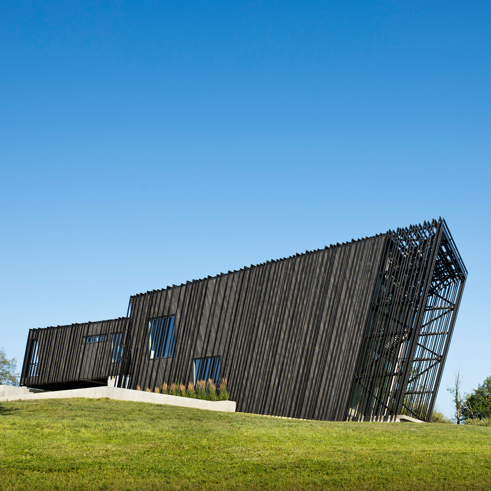 A/O builds slanted black holiday home in Hudson Valley-0