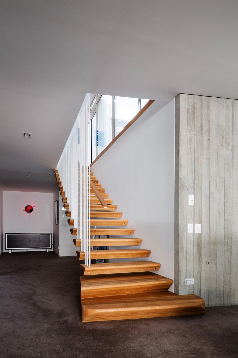 Warm and comfortable interior of a house which contrasts with the sleek exterior of white pre coloured fibre cement   CAANdesign  Architecture and home design blog-13
