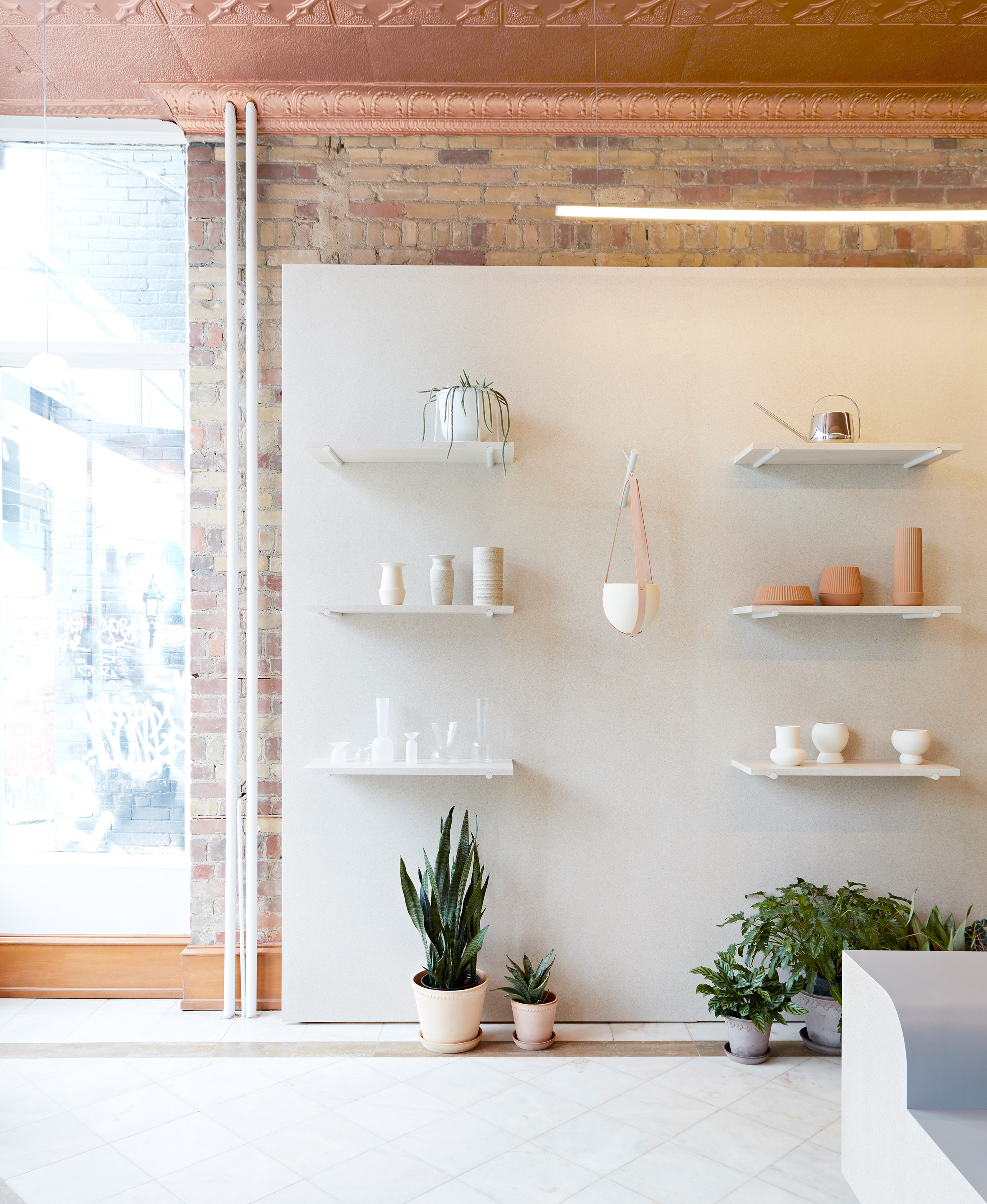 Toronto flower shop by MSDS Studio features pale walls and linoleum-covered furniture-17