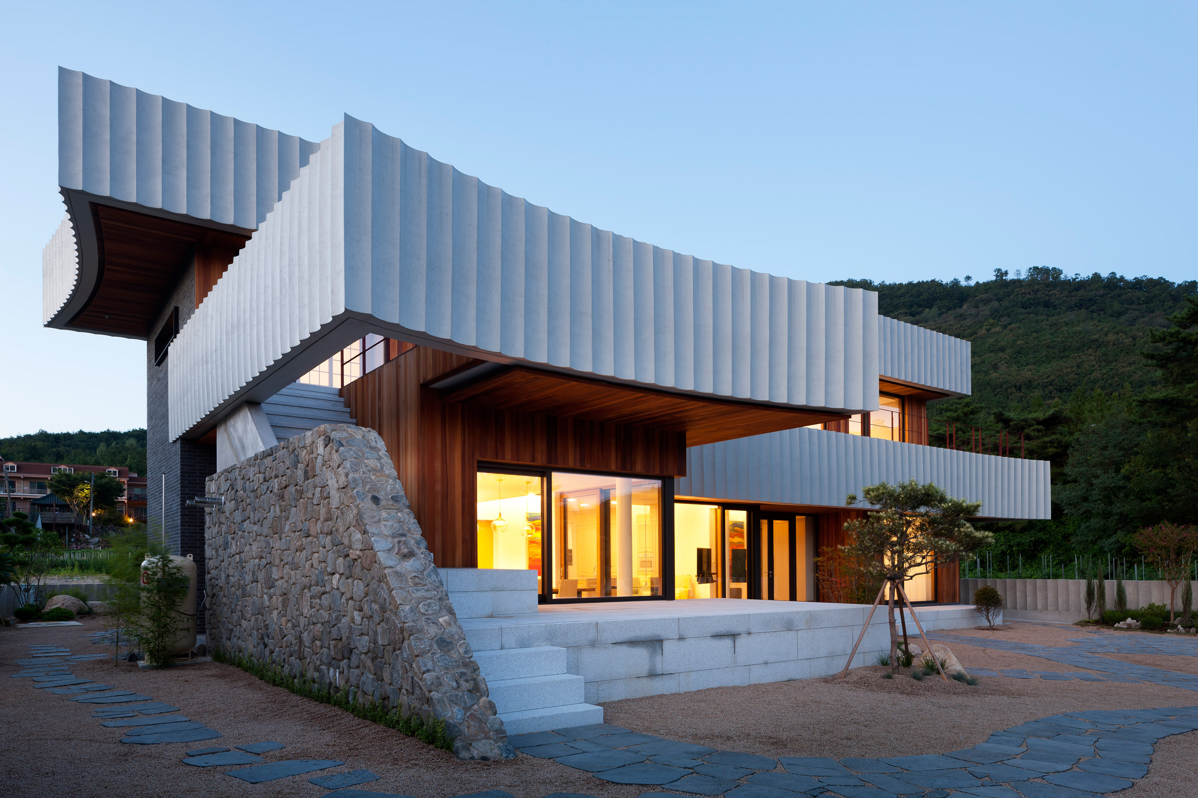 Ridged ribbons of concrete wrap house in South Korea by ODE Architects-21