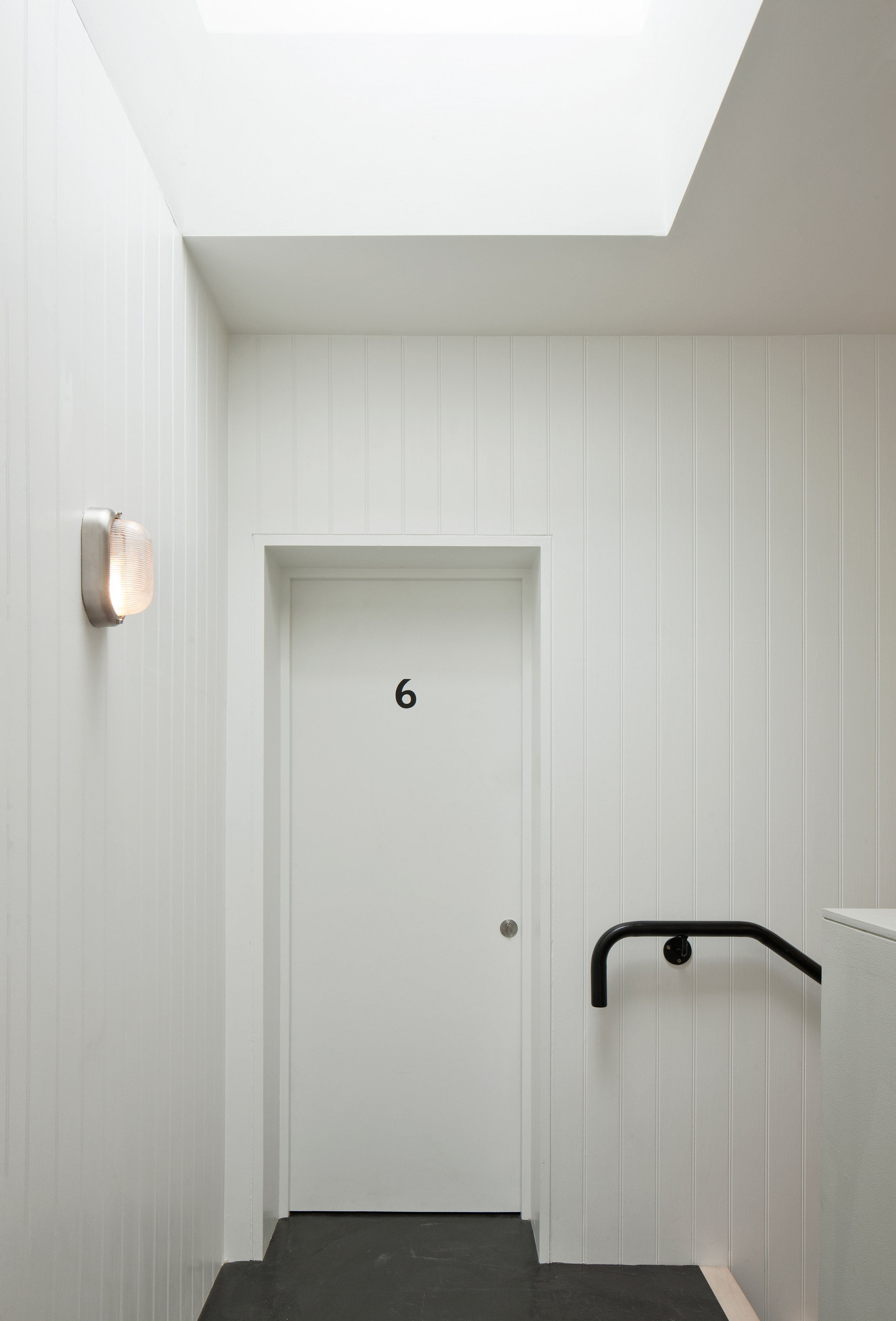 Denizen Works pairs black bricks with pointy panels for Whitstable housing-23