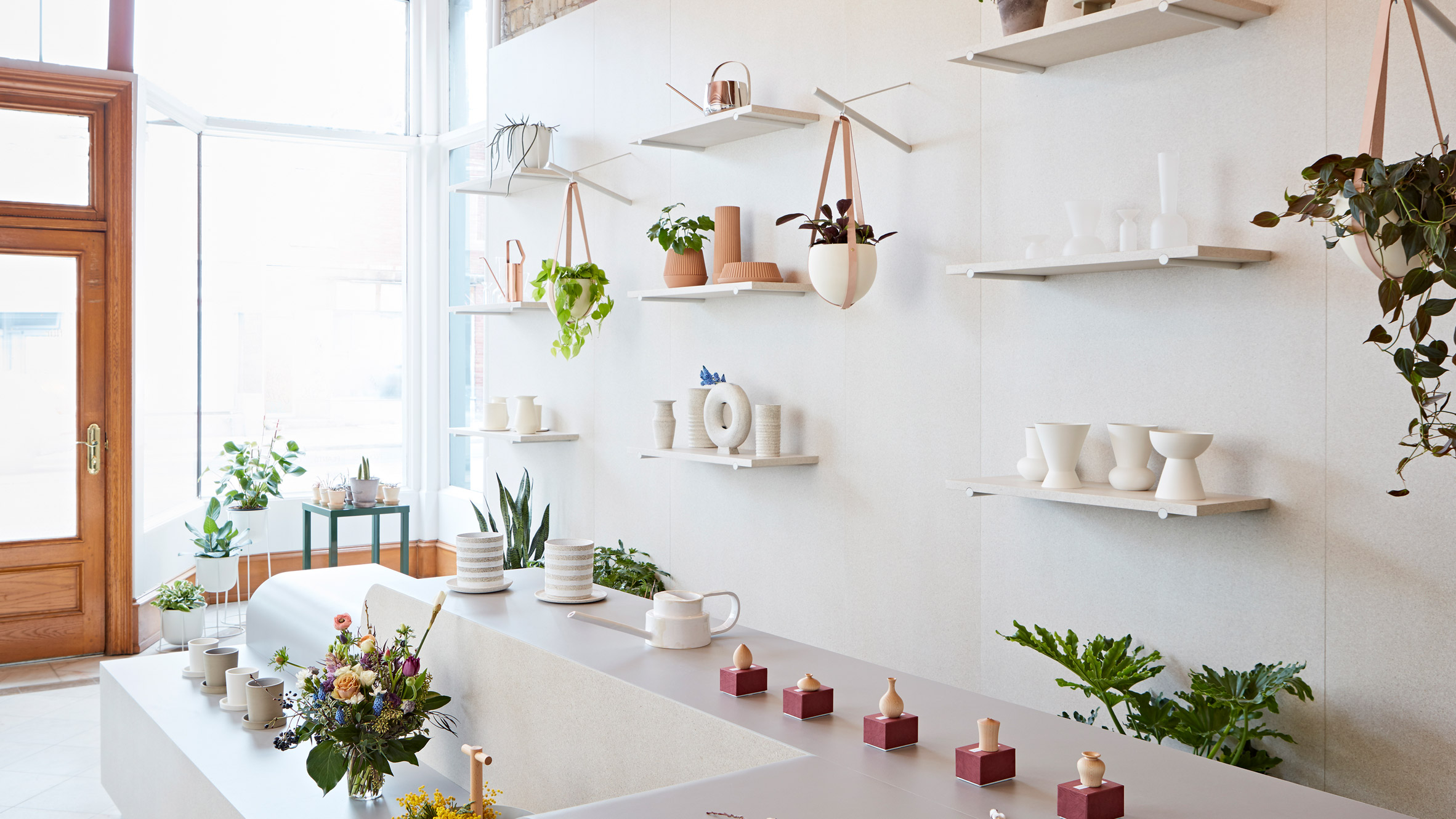 Toronto flower shop by MSDS Studio features pale walls and linoleum-covered furniture-0