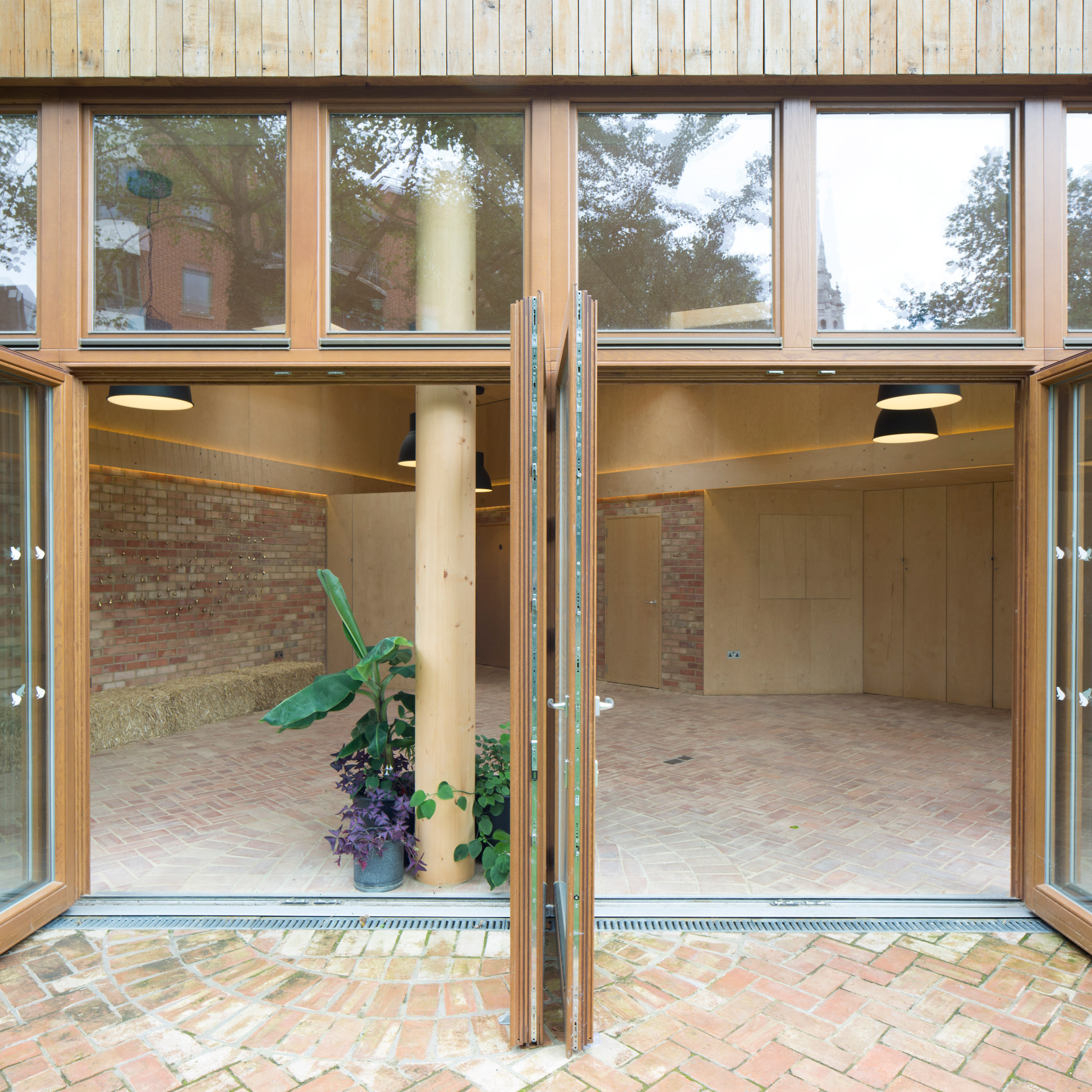 Office Sian adds brick and limestone building to London community garden-21