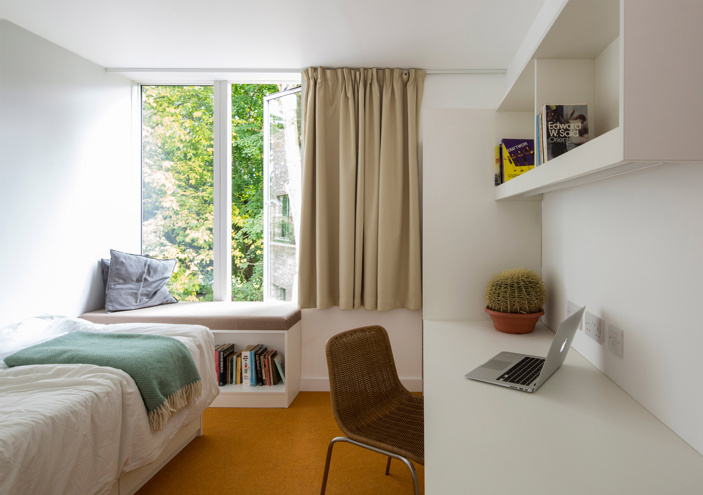 Geometric brick-clad boarding house by MICA references its neighbours-23