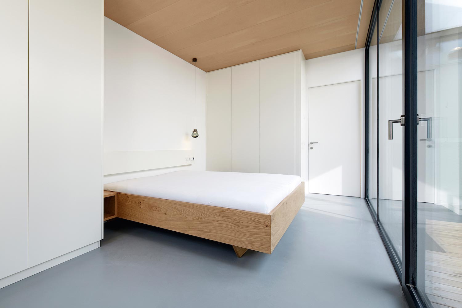 Concrete house uses old walls to create private patio allowing to add full glass walls to the residence   CAANdesign  Architecture and home design blog-14