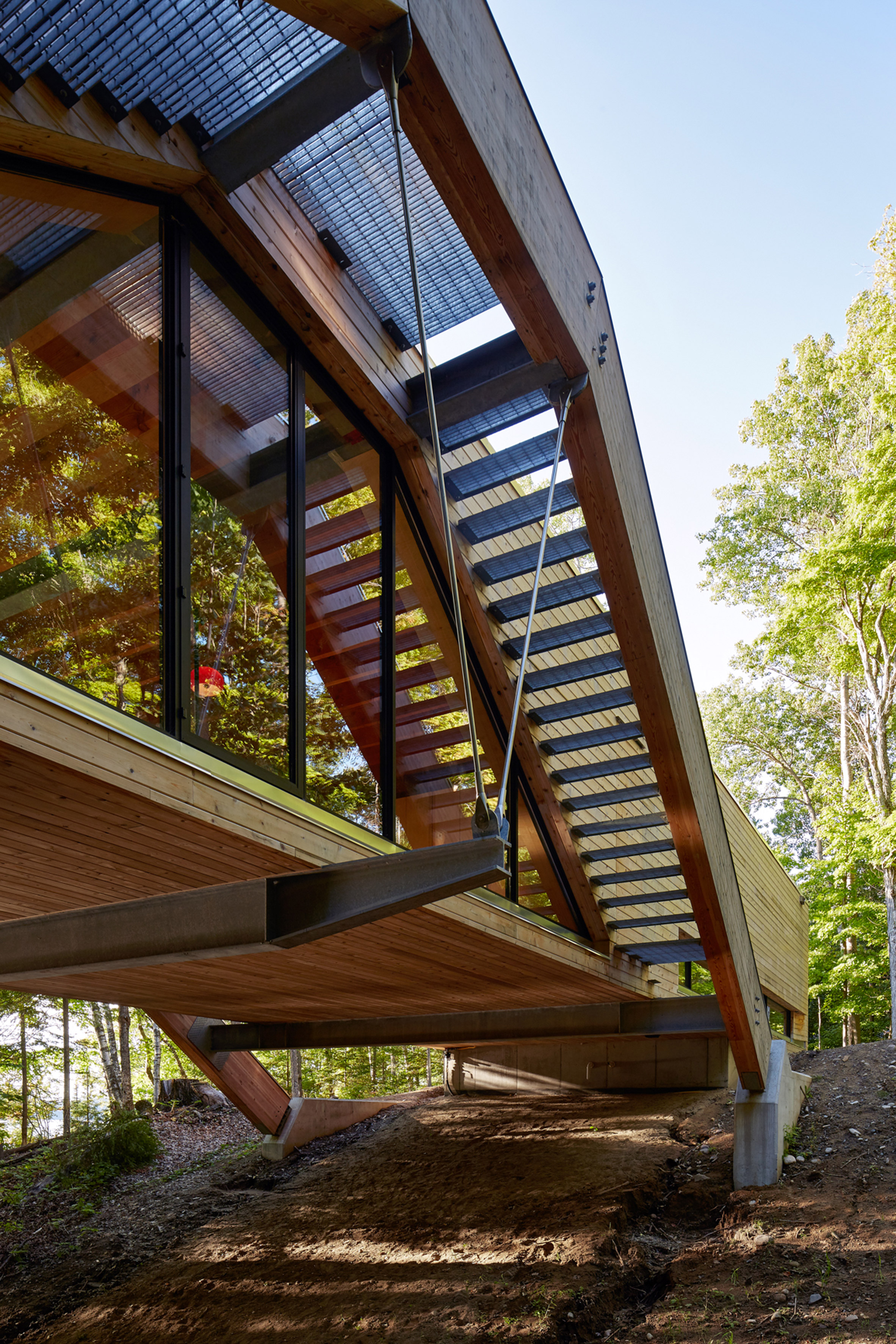 Bridgehouse by Llama Urban Design spans over Canadian forest floor-16