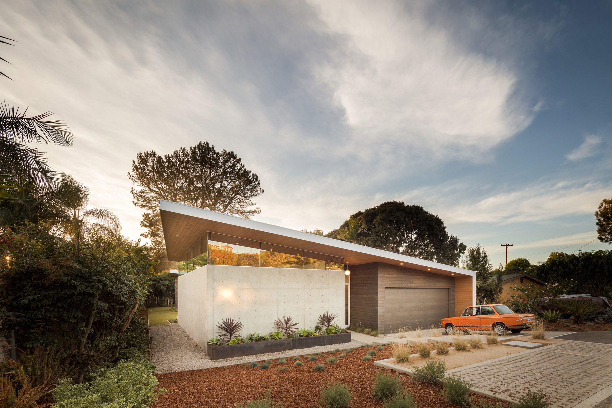 Southern California beach home features angled roof with crescent cutout-23