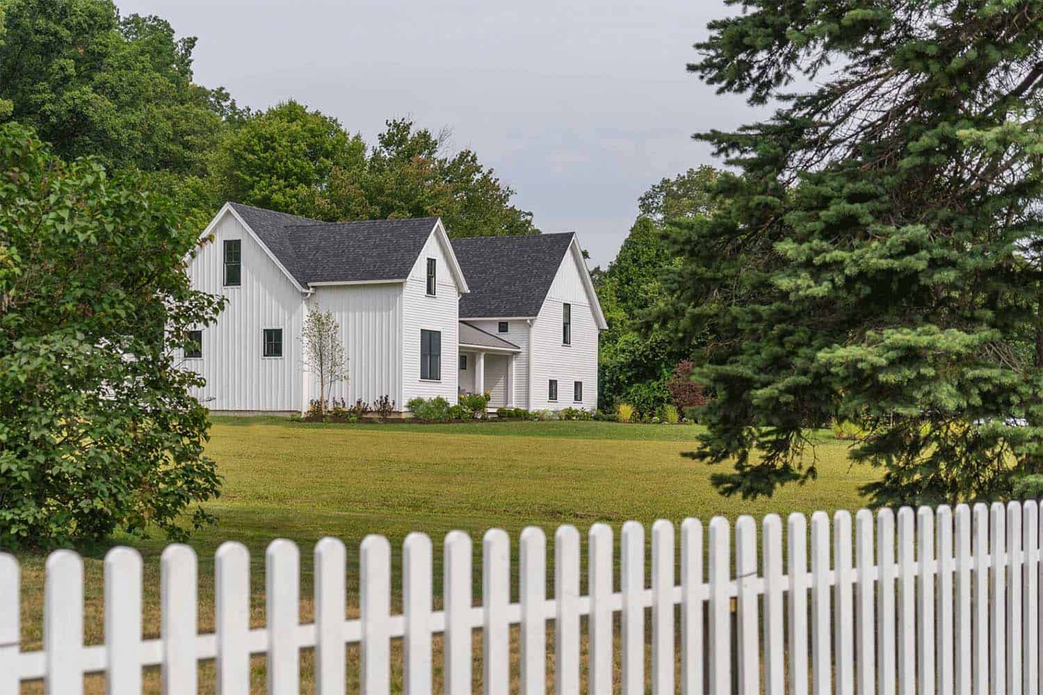 Modern farmhouse style nestled in an idyllic woodsy New England setting-17