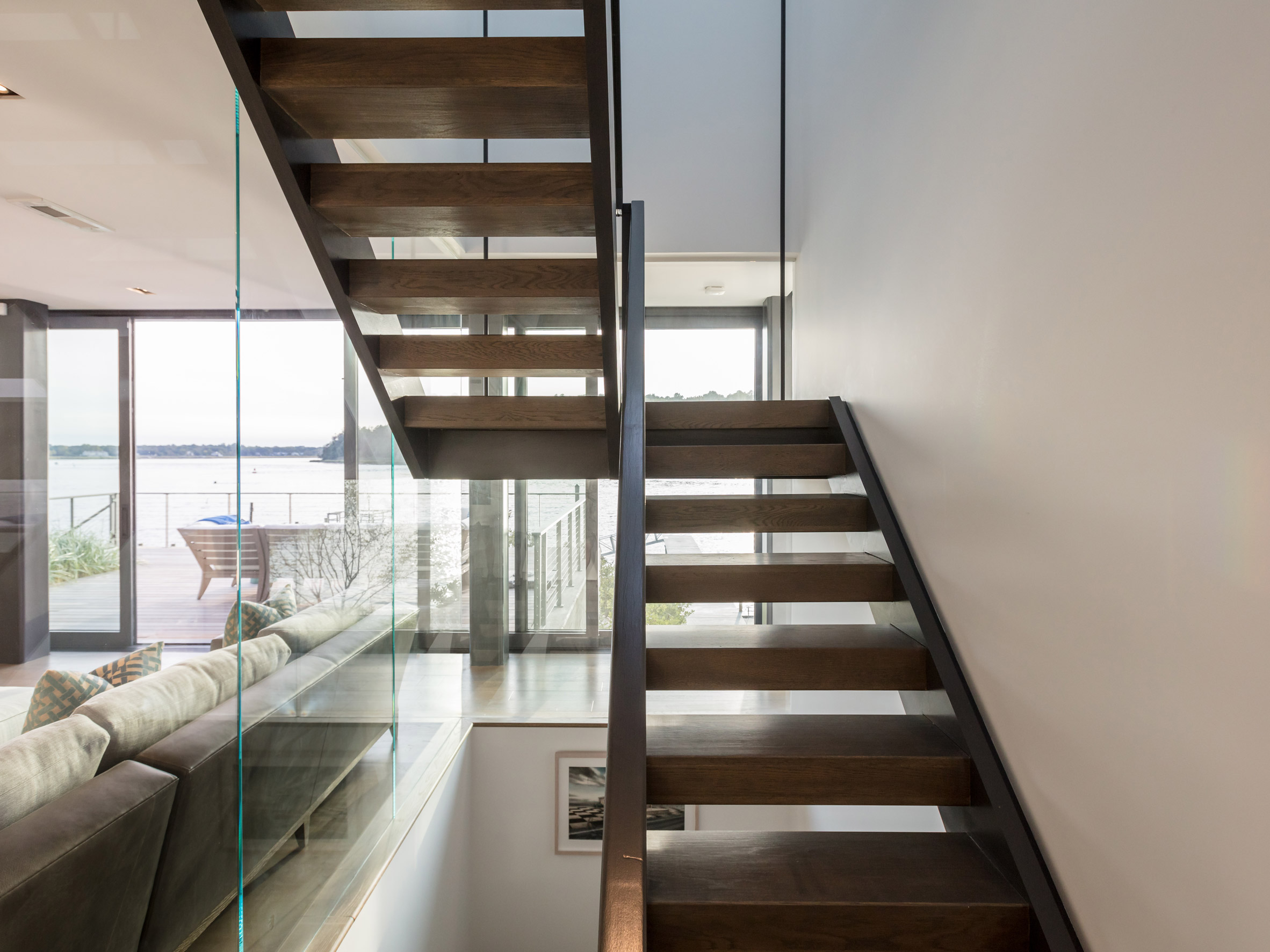 Pale cedar beach house by Raad Studio perches atop a sand dune-11