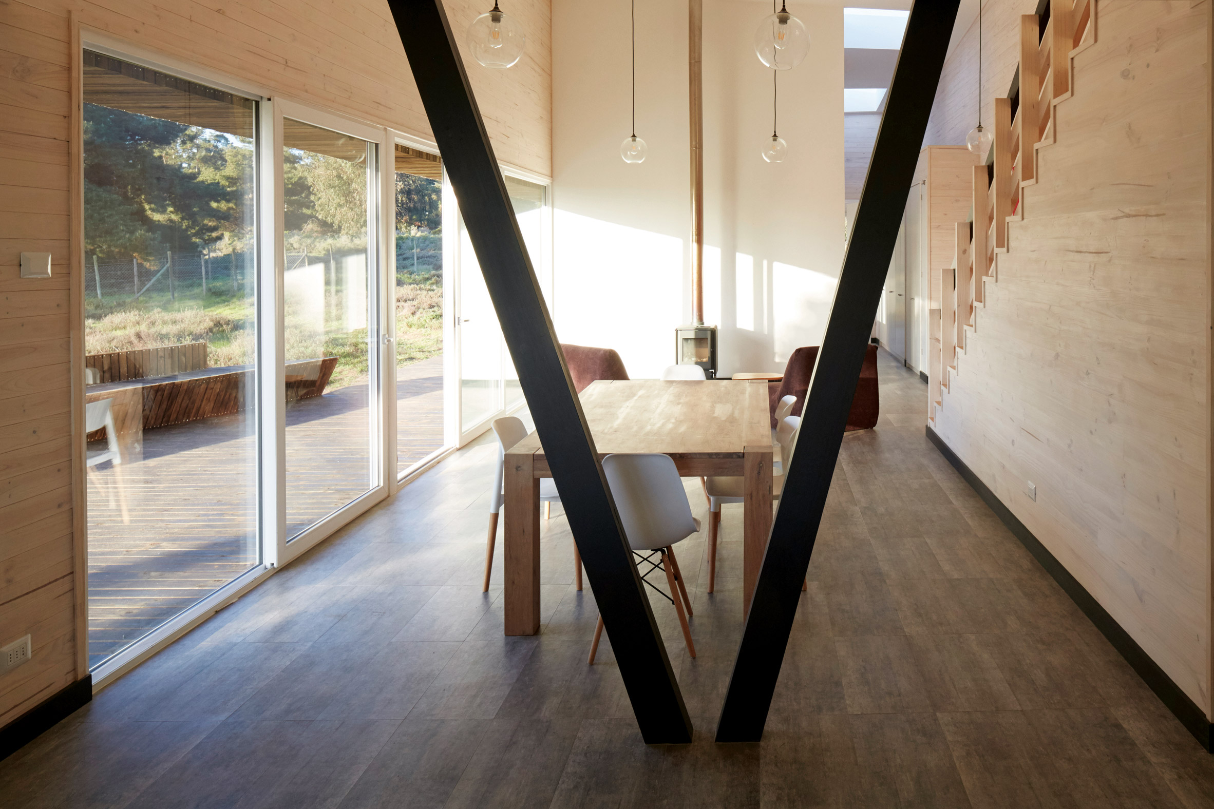 Faceted house in Chile by Verónica Arcos offers ocean views through the forest-12