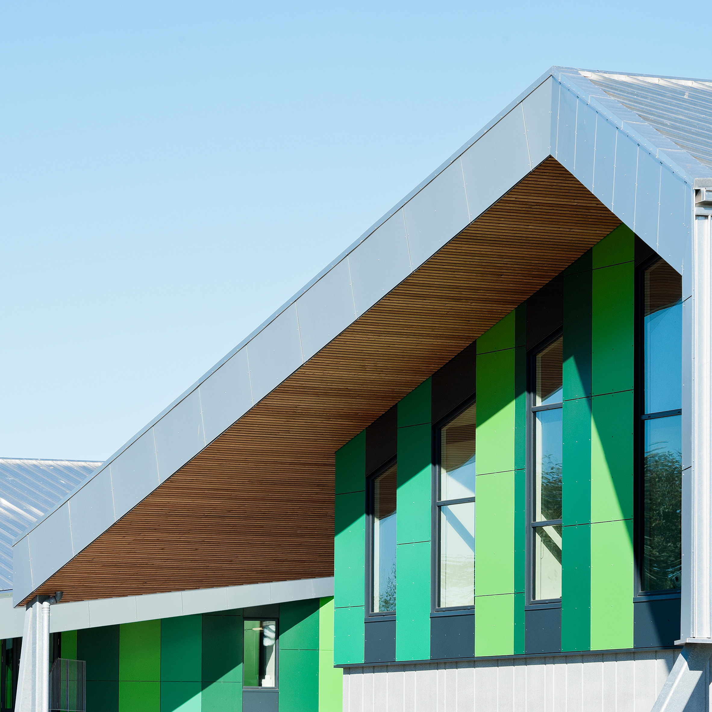 CEBRA completes Danish school with jagged roofs and stripy walls-0