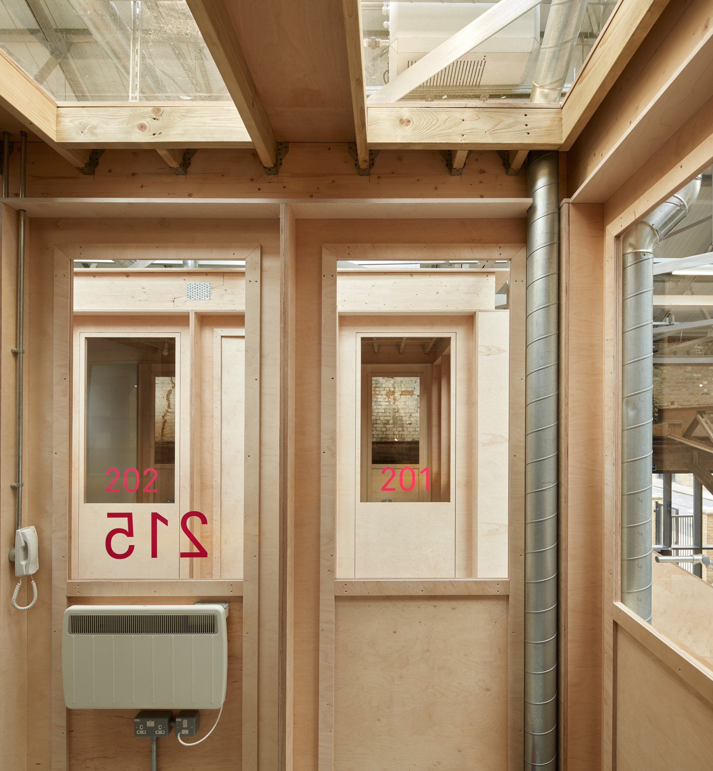 Emrys Architects converts east London ironworks into studios-11