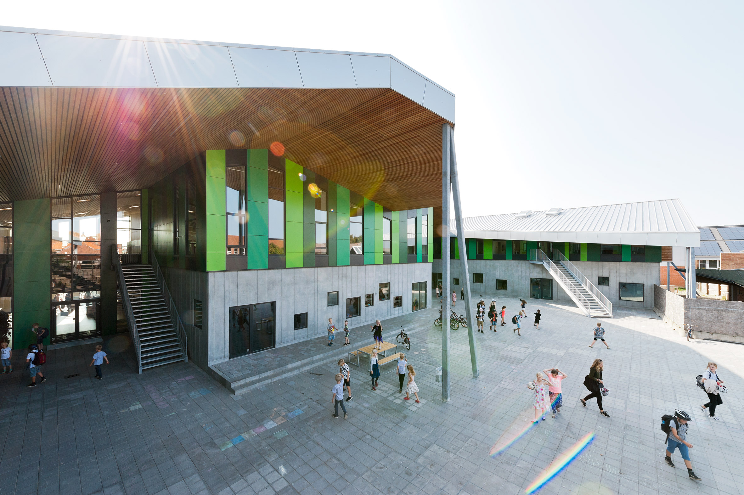 CEBRA completes Danish school with jagged roofs and stripy walls-3