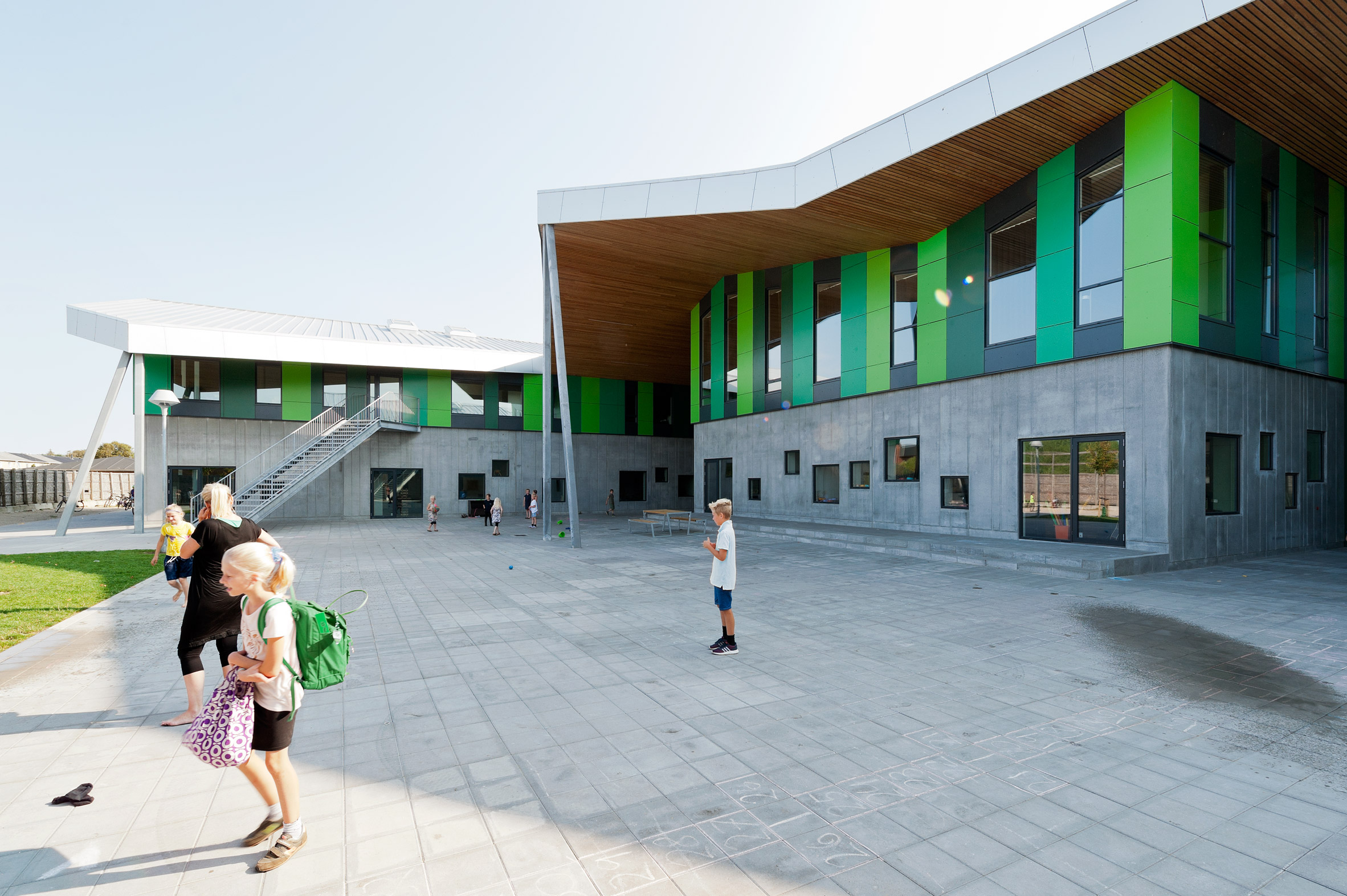 CEBRA completes Danish school with jagged roofs and stripy walls-5